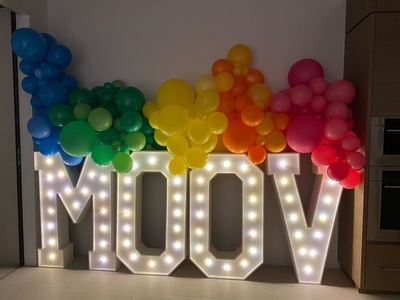 Lit up sign that says Moov